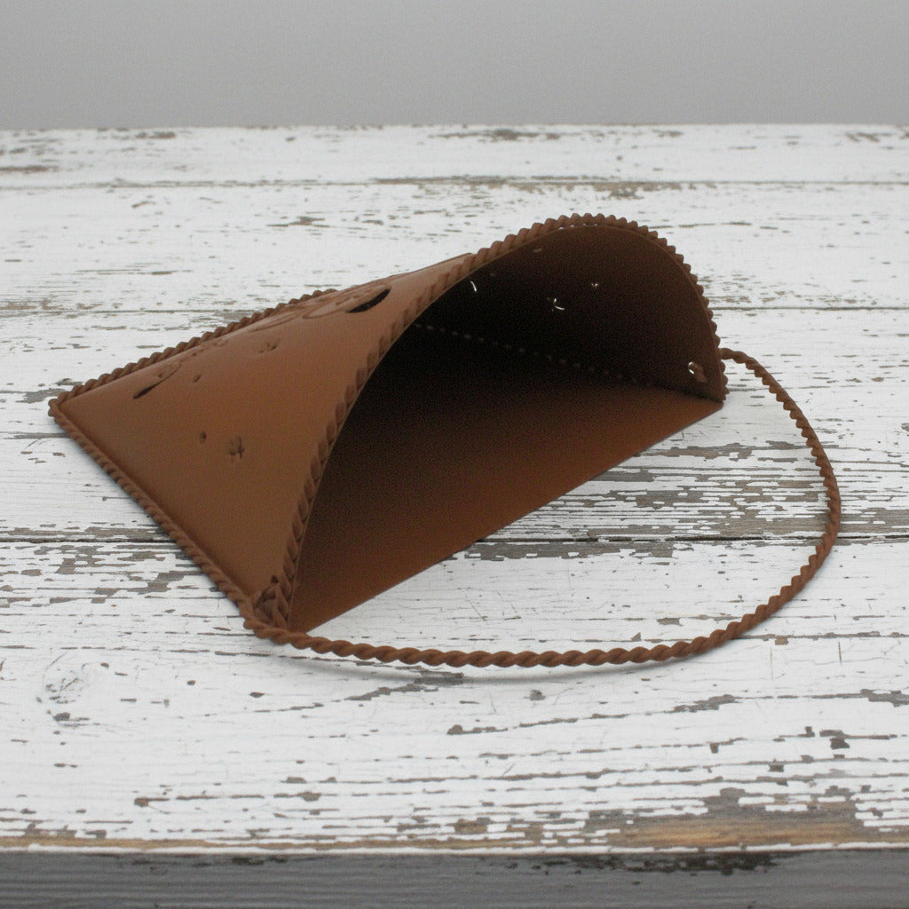 Rusty tin wall pocket with a butterfly punched design