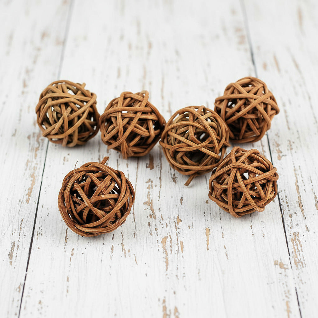 Set of six woven rattan balls on a white background