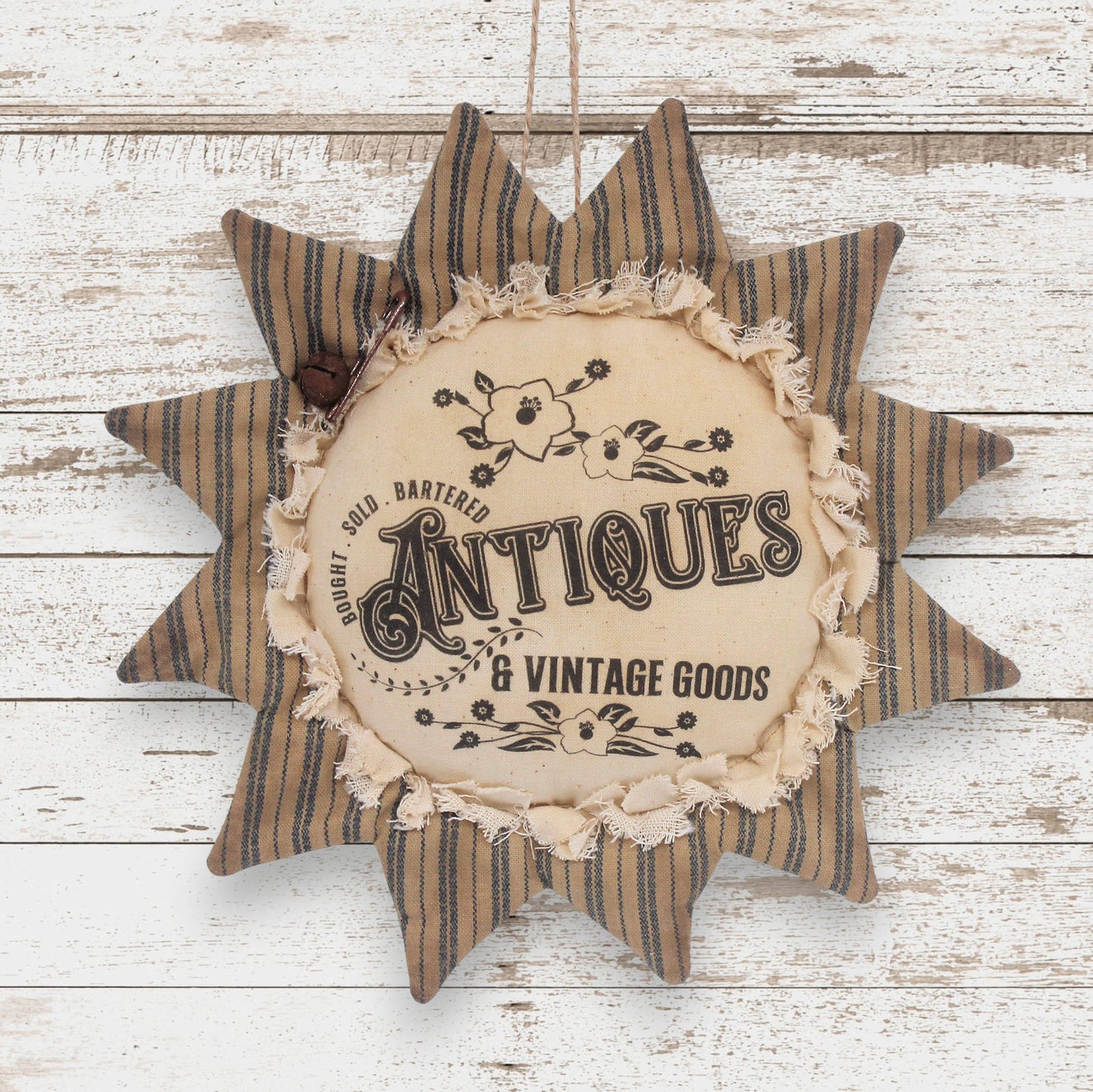 Primitive fabric sunflower ornament with an advertisement for vintage and antiques goods