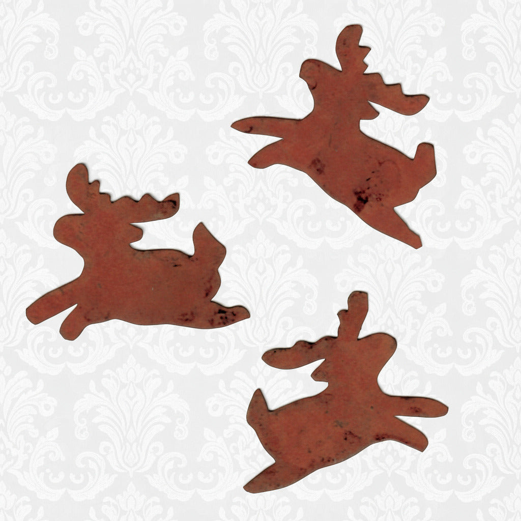 Three rust-colored metal reindeer shapes on a white background