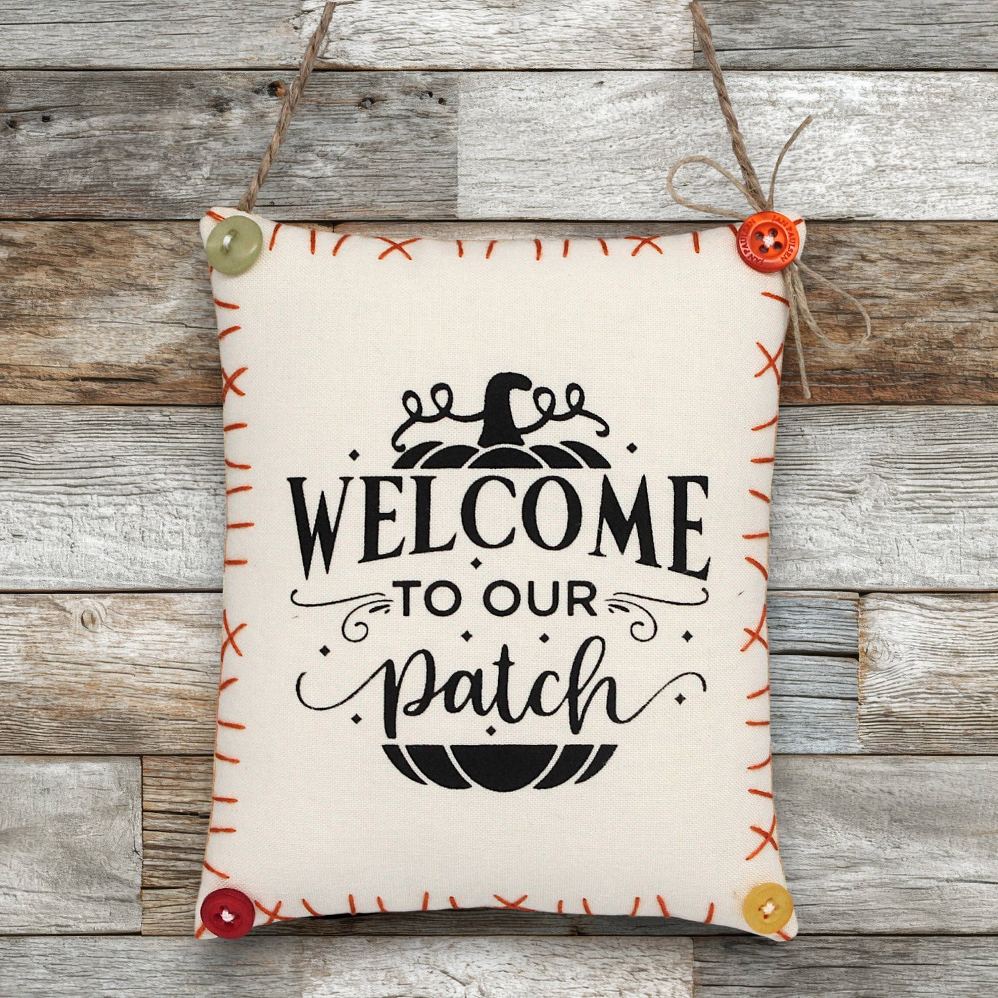 Decorative sign ornament with 'Welcome to our patch' text on a wooden background