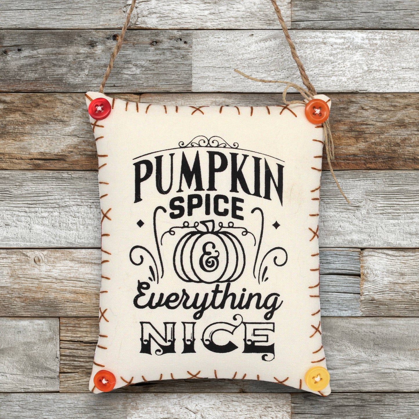 Fabric sign ornament that reads 'pumpkin spice and everything nice'
