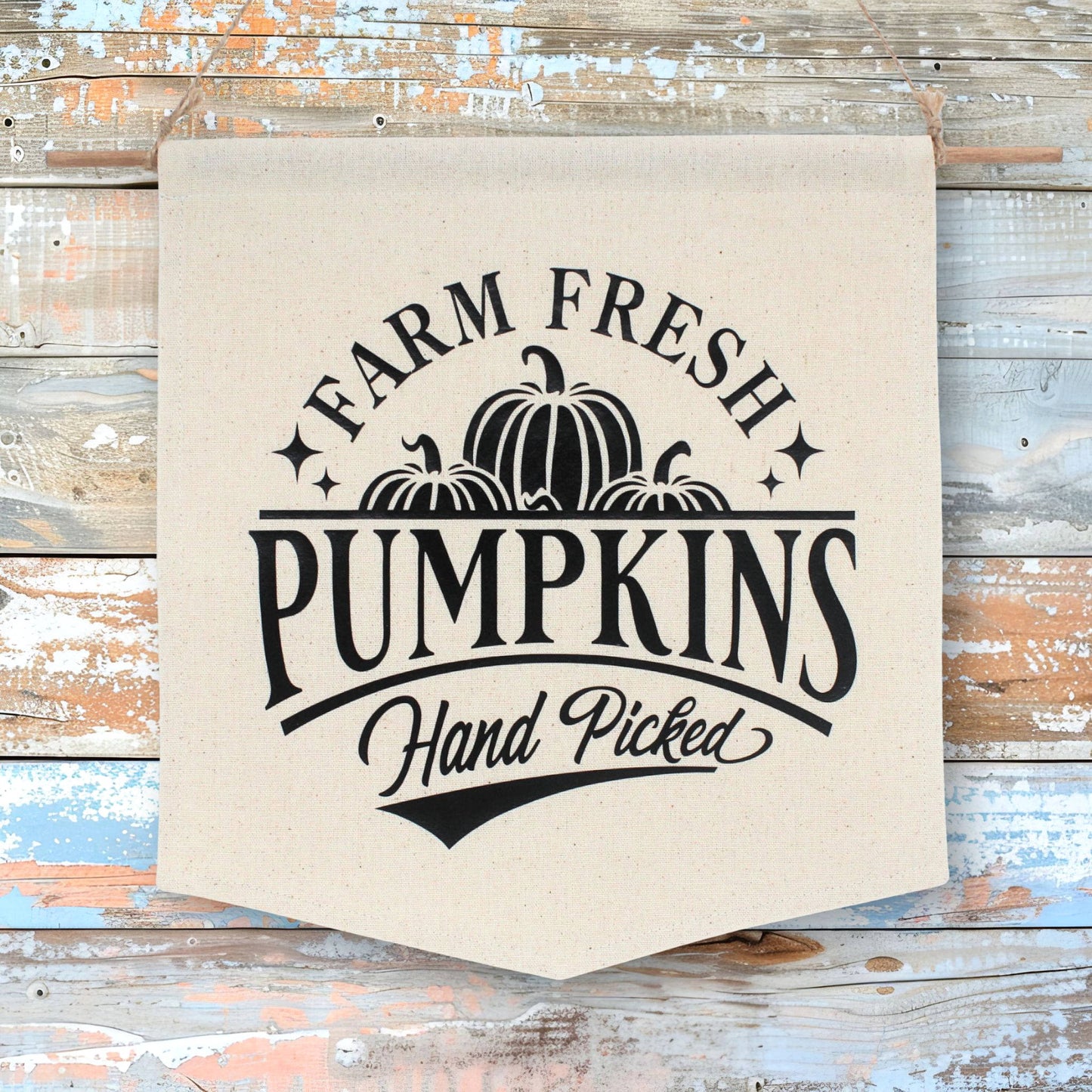 Canvas banner with 'Farm Fresh Pumpkins Hand Picked' text and pumpkin graphics on a wooden background