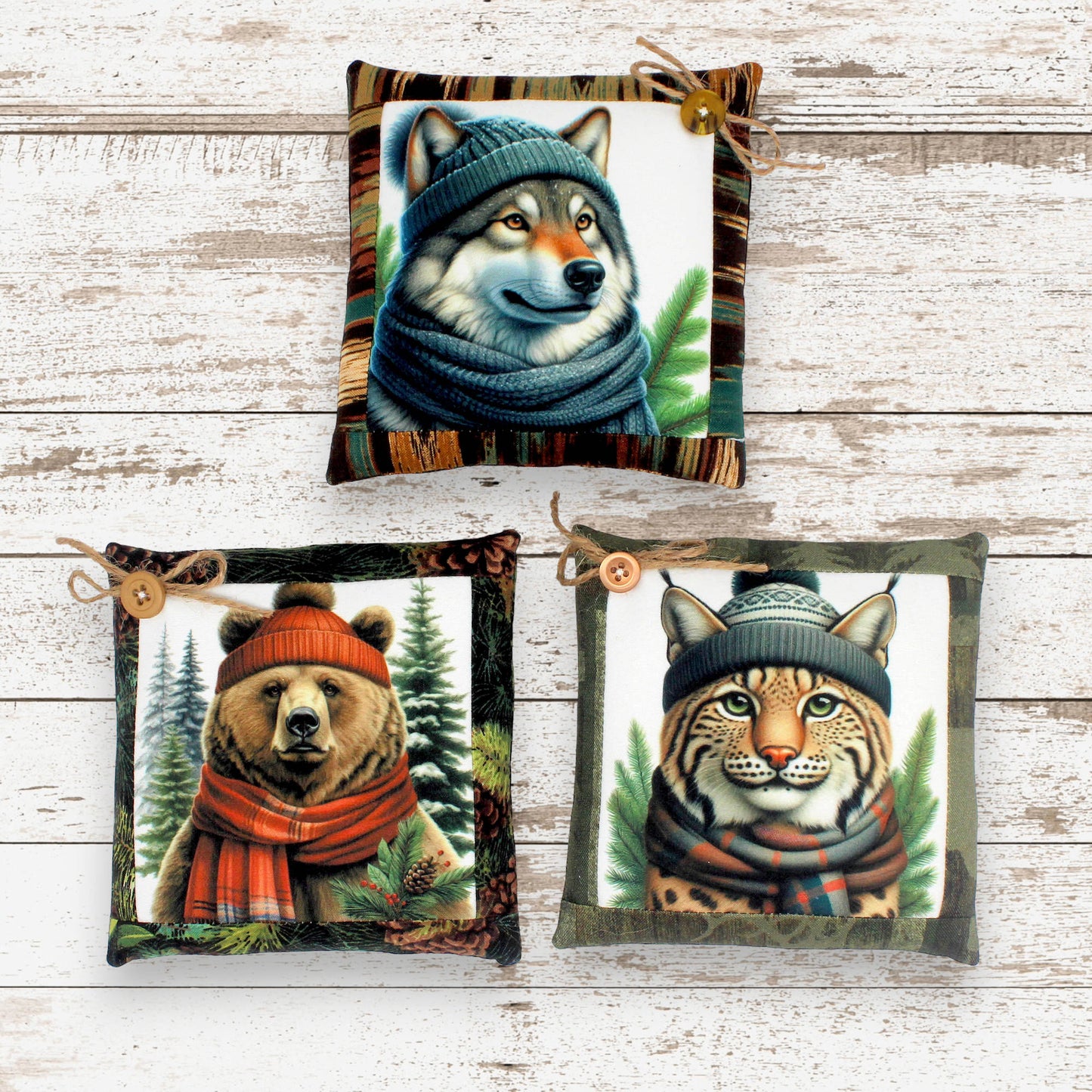 Set of three mini pillow bowl fillers with images of wild forest animals wearing winter clothing