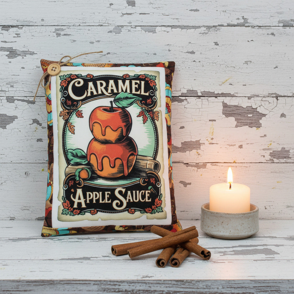 Vintage-style label for caramel apple sauce with an apple illustration on a wooden surface.