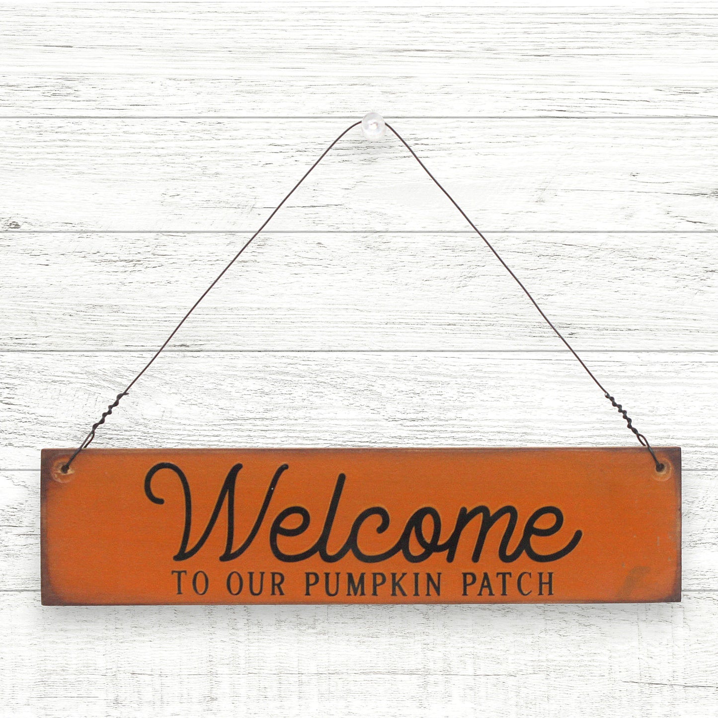 Small distressed handcrafted wooden sign which reads 'welcome to our pumpkin patch'