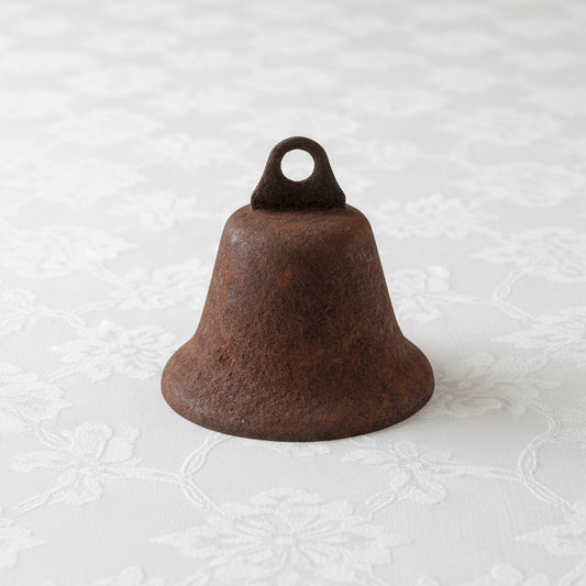Rust-colored Liberty bell with a loop on a white background