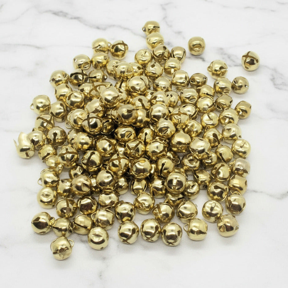 Gold jingle bells on a white background