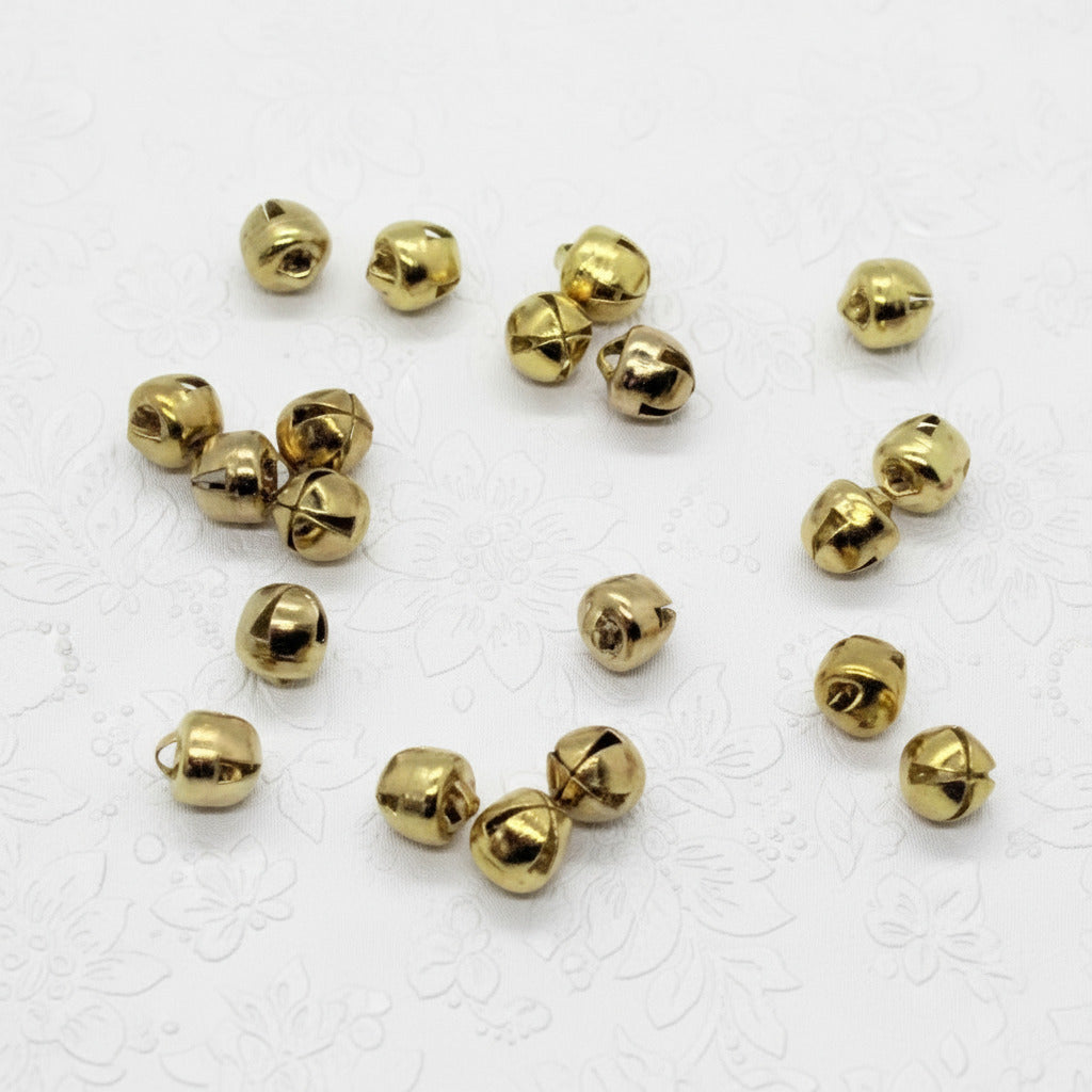 Gold jingle bells on a white background