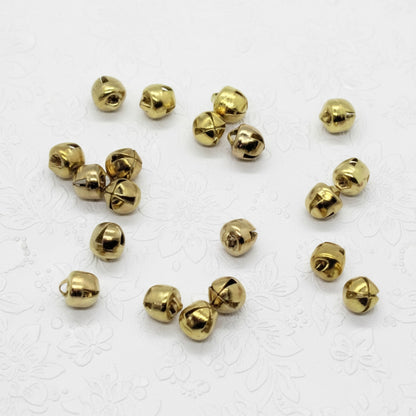 Gold jingle bells on a white background