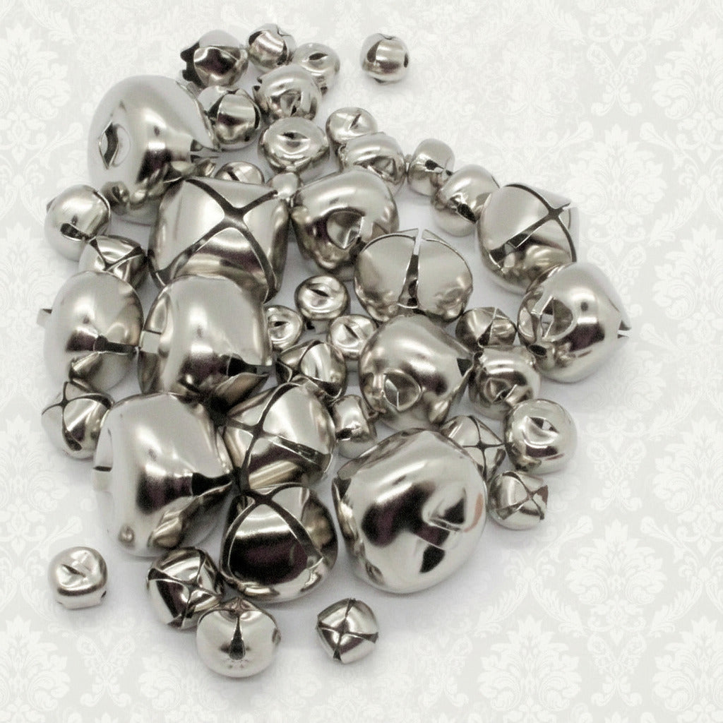 Pile of silver bells on a white background