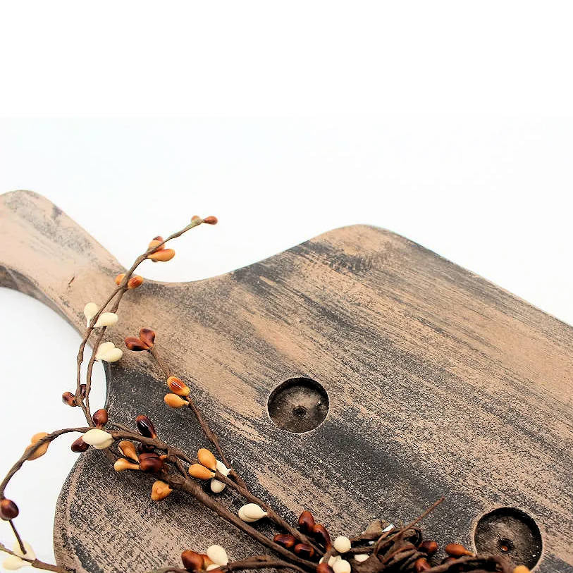 wooden bread board candle holder with pip berries