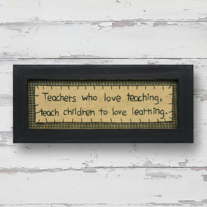Primitive stitchery sign that reads Teachers who love teaching teach children to love learning