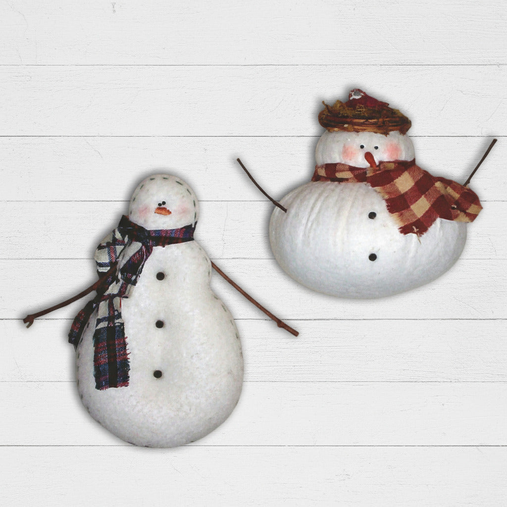 Two snowman ornaments with scarves and hats on a white background