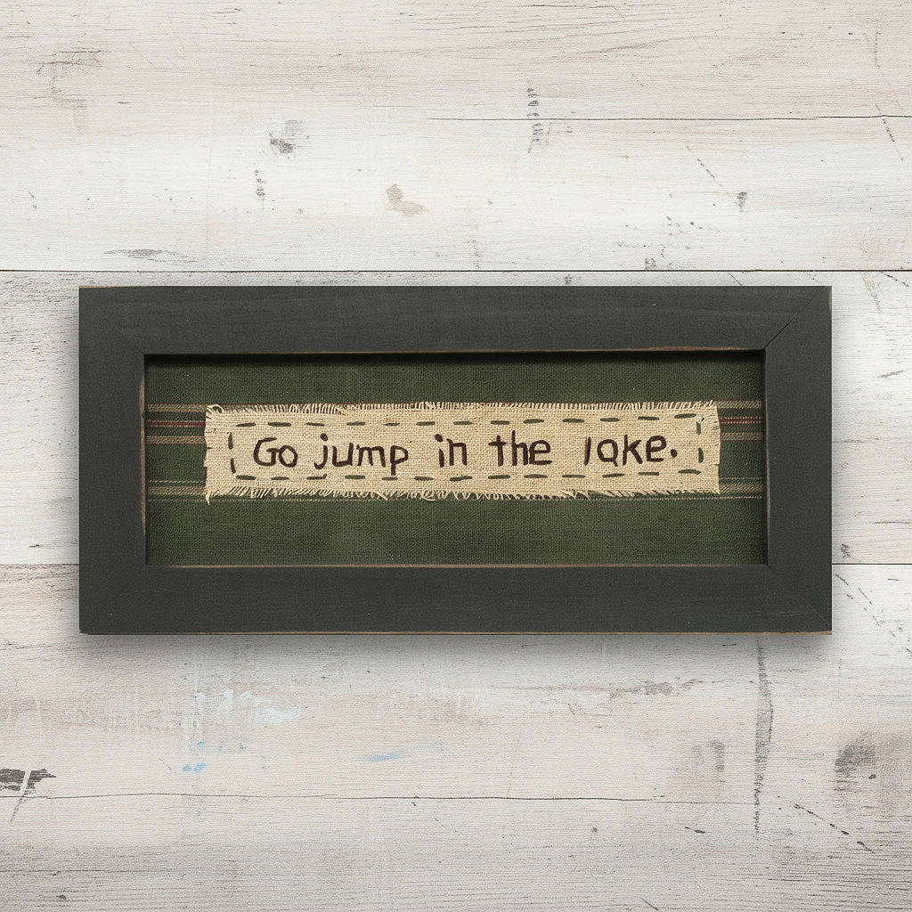 Framed text art with 'Go jump in the lake.' on a wooden background