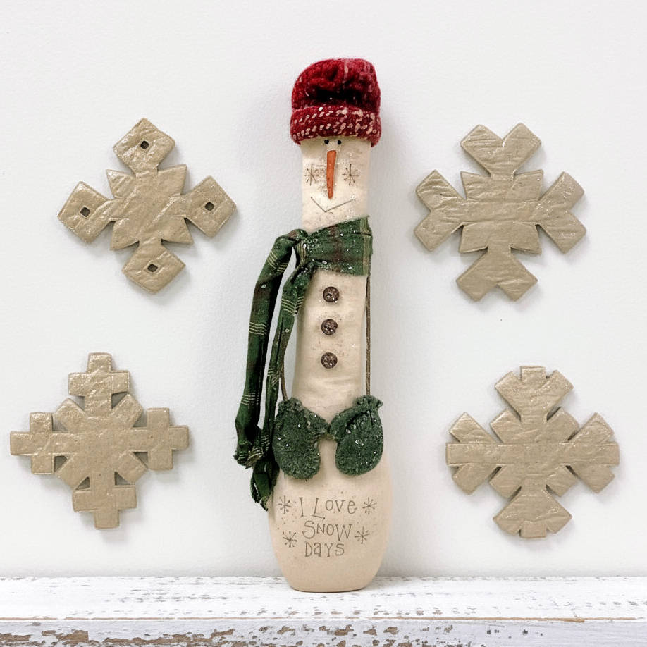 Primitive snowman doll and snowflakes pattern
