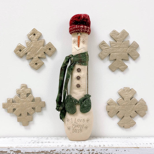 Primitive snowman doll and snowflakes pattern