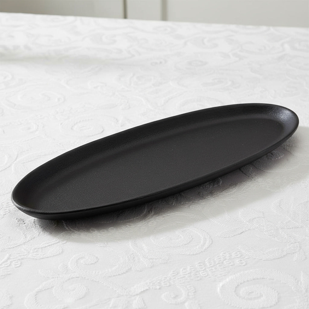 Black oval tray on a white background