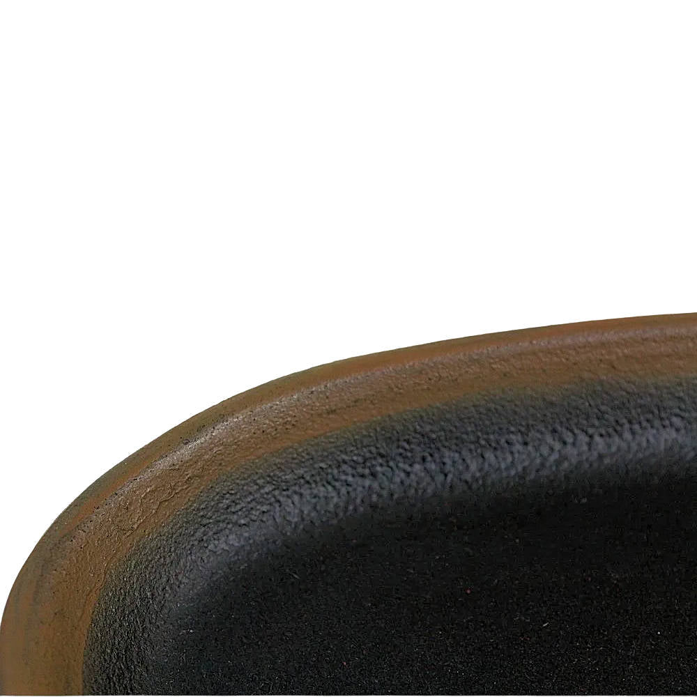 Black oval tray with brown rim on a white background