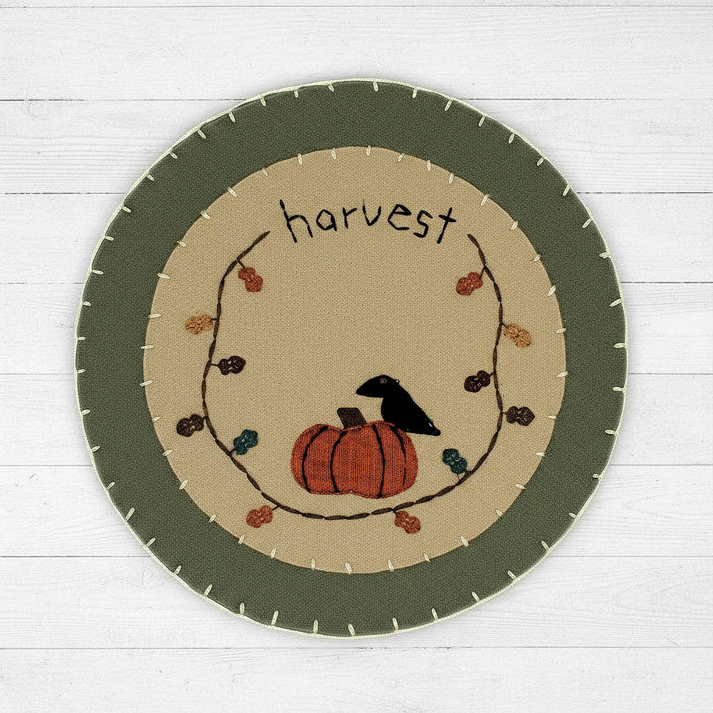 Felt candle mat with crow and pumpkin design