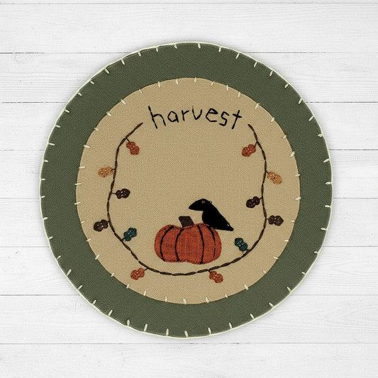 Felt candle mat with crow and pumpkin design