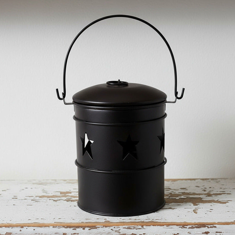 Black bucket candle holder with folk star design