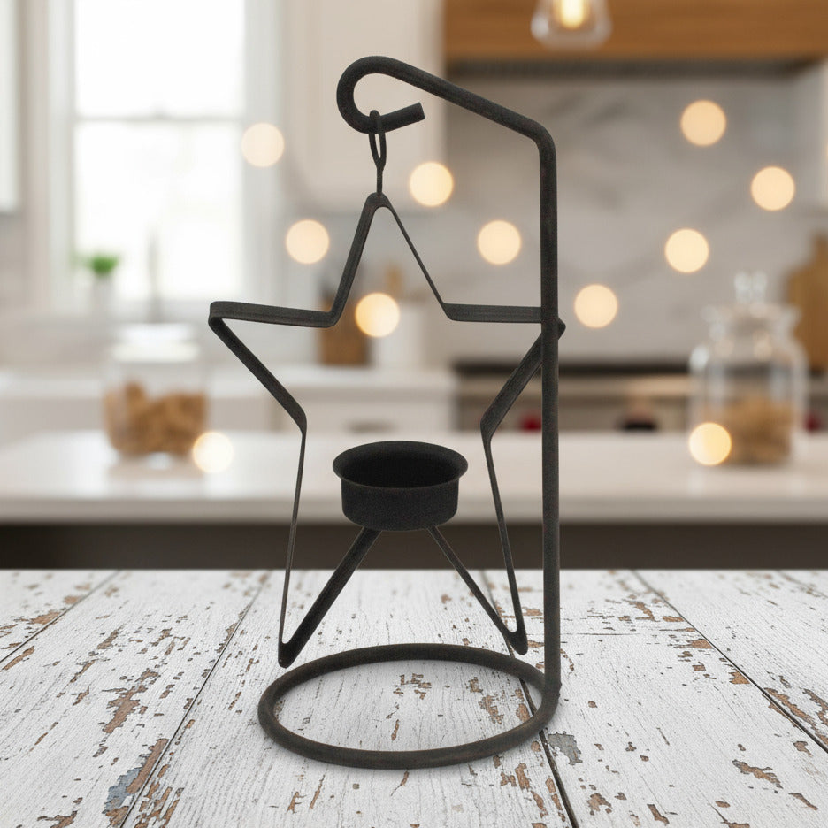 Black star-shaped tea light candle holder