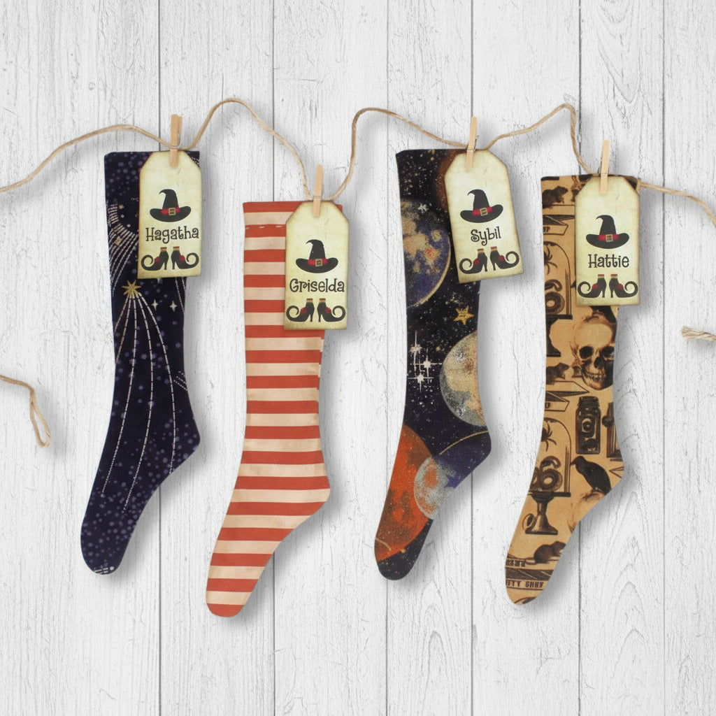 Four Halloween-themed socks with unique designs and labels on a white background