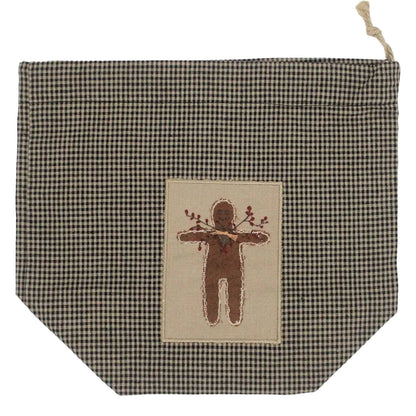 Checkered drawstring bag cube tissue box cover with embroidered gingerbread design on a white background