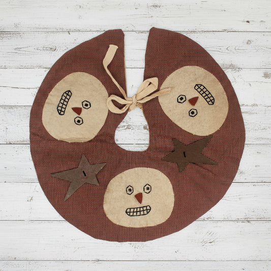 Primitive homespun mini Christmas tree skirt with snowman faces and rusty stars