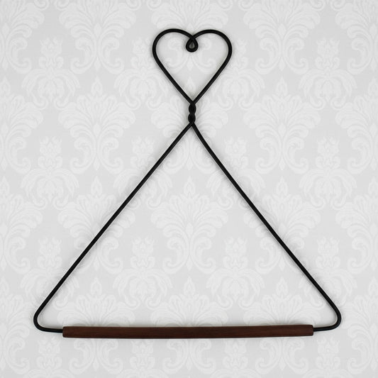 Black wire hanger with a wooden rod on a white background