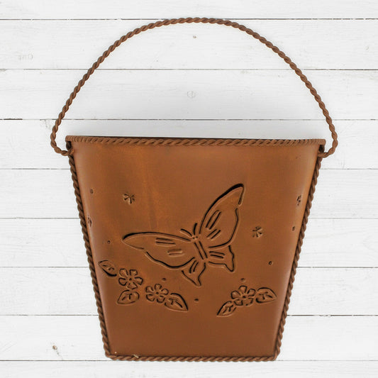 Rusty tin wall pocket with a butterfly design