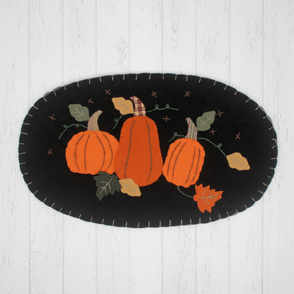 Oval felt pumpkin patch candle mat