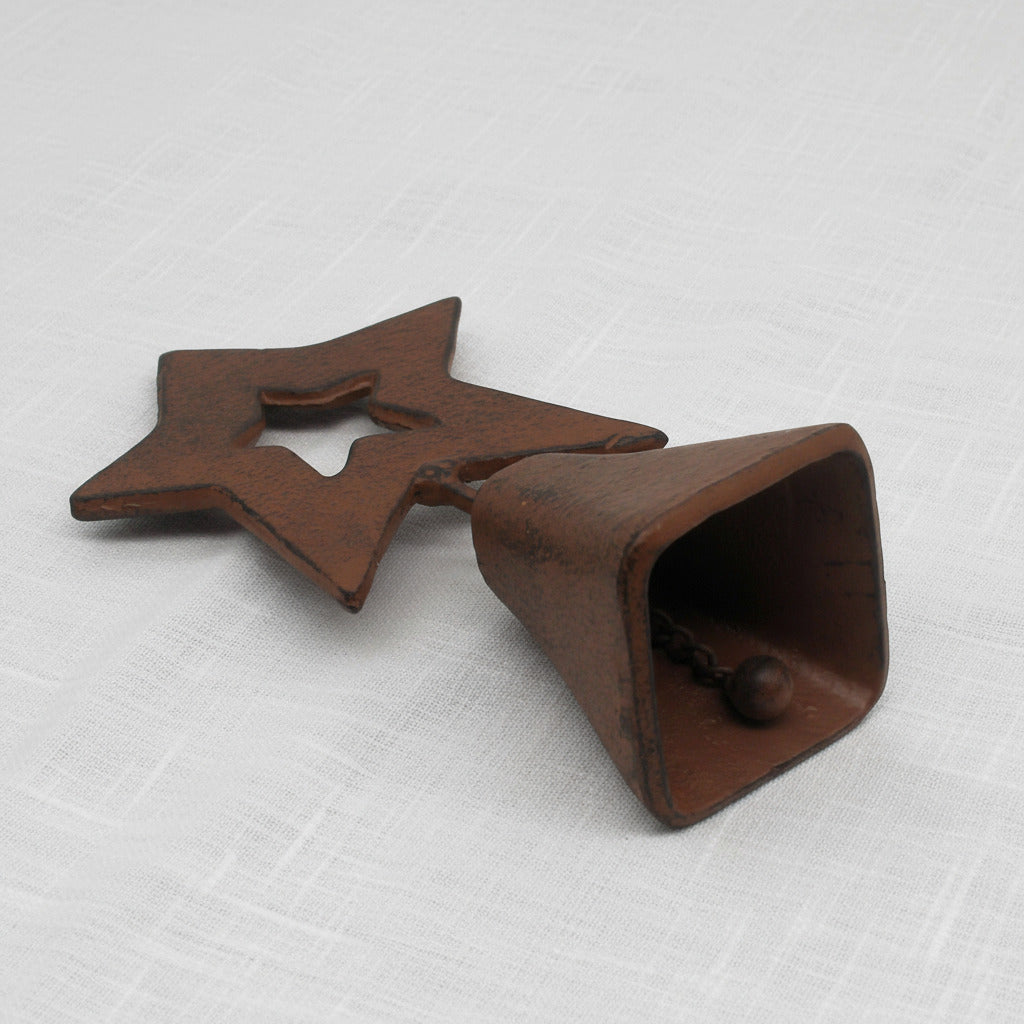 Decorative cast iron bell with a star design