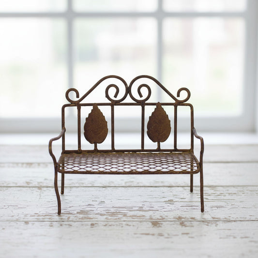 Miniature rusty tin mesh garden bench