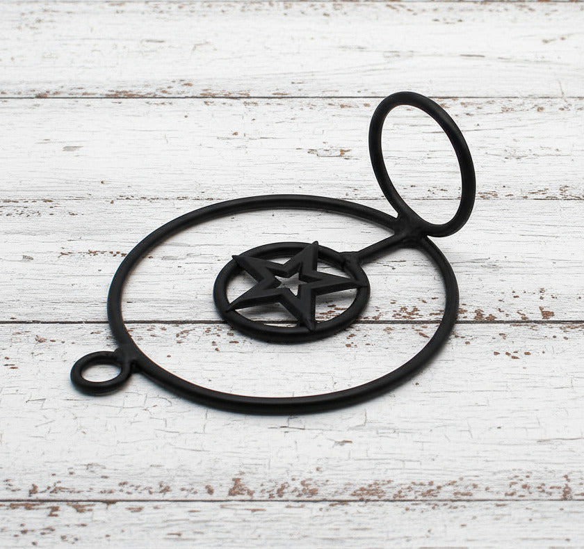 Black wrought iron votive candle holder with star design