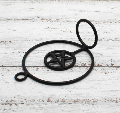 Black wrought iron votive candle holder with star design