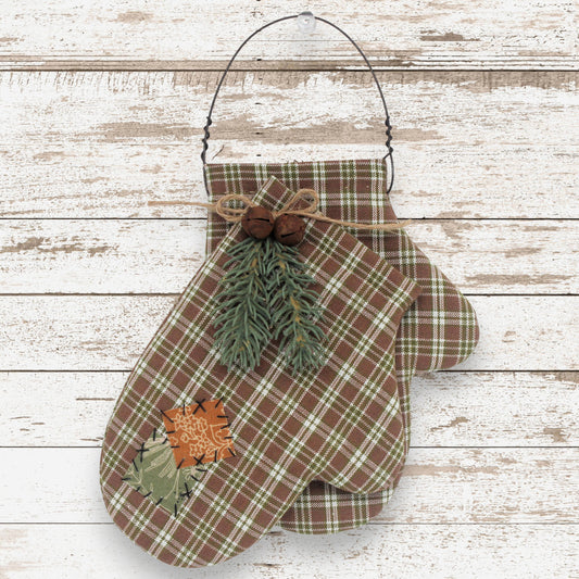 Handcrafted primitive homespun mittens ornament decorated with pine, rusty jingle bells and patches
