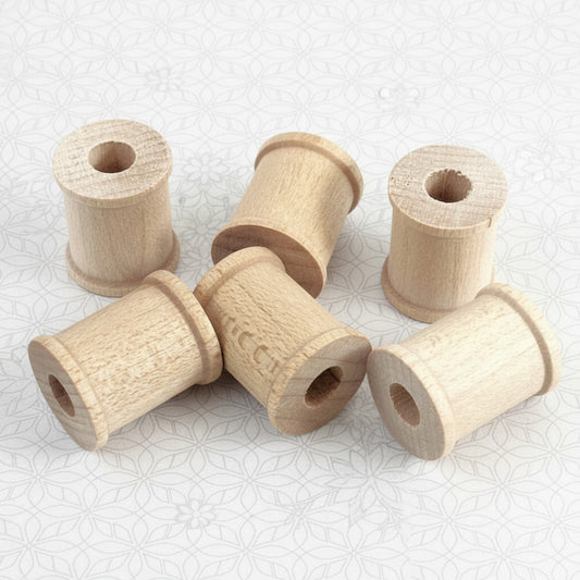 Miniature unfinished wooden spools