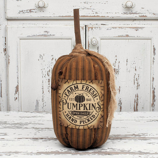 Decorative pumpkin with 'Farm Fresh Pumpkins' label on a white background