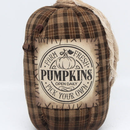 Fabric pumpkin with 'Farm Fresh Pumpkins' label on a white background