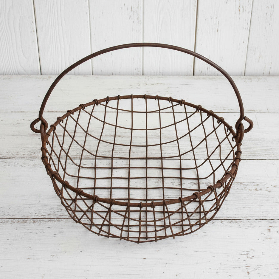Rustic wire basket on a white background