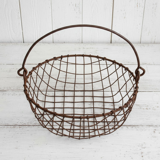 Rustic wire basket on a white background