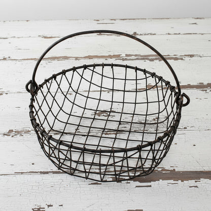 Wire basket with handle on a white background