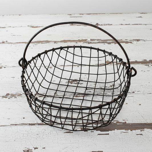 Wire basket with handle on a white background