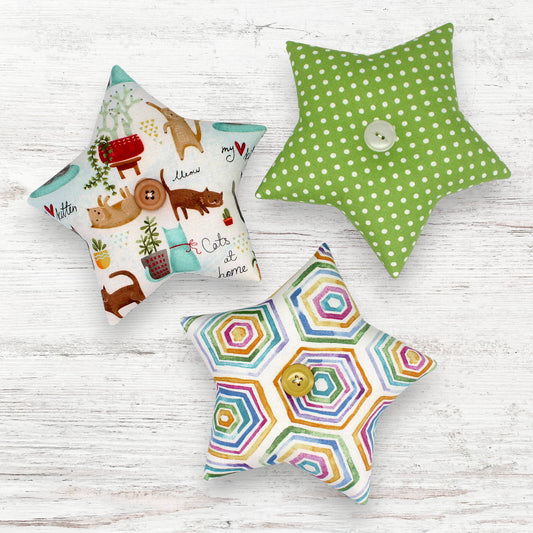 Set of three star-shaped bowl fillers with bright colors and whimsical cats