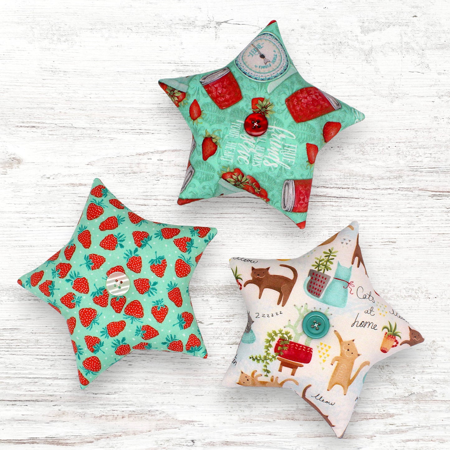 Set of three fabric stars bowl fillers with strawberry and cats designs