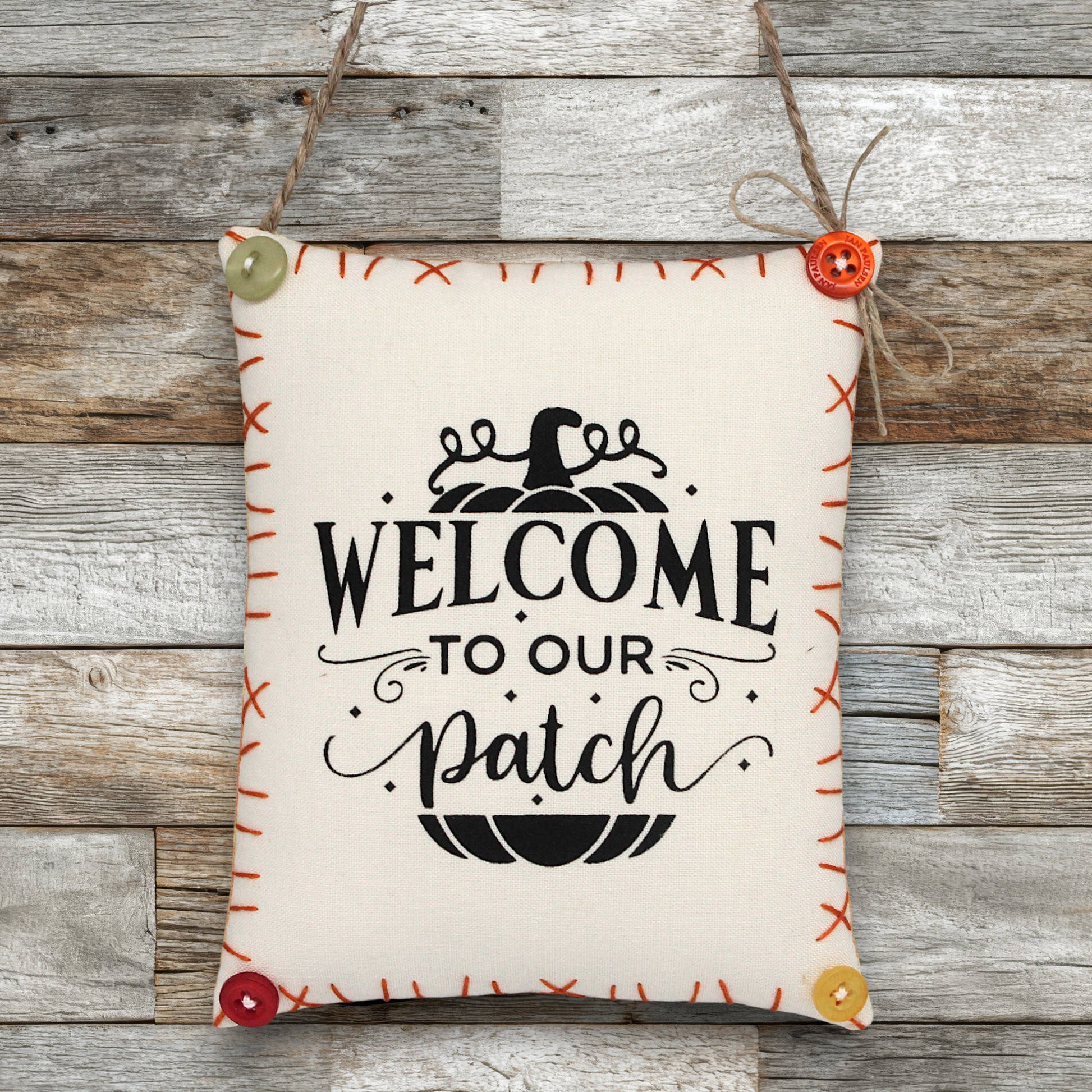 Decorative sign ornament with 'Welcome to our patch' text on a wooden background