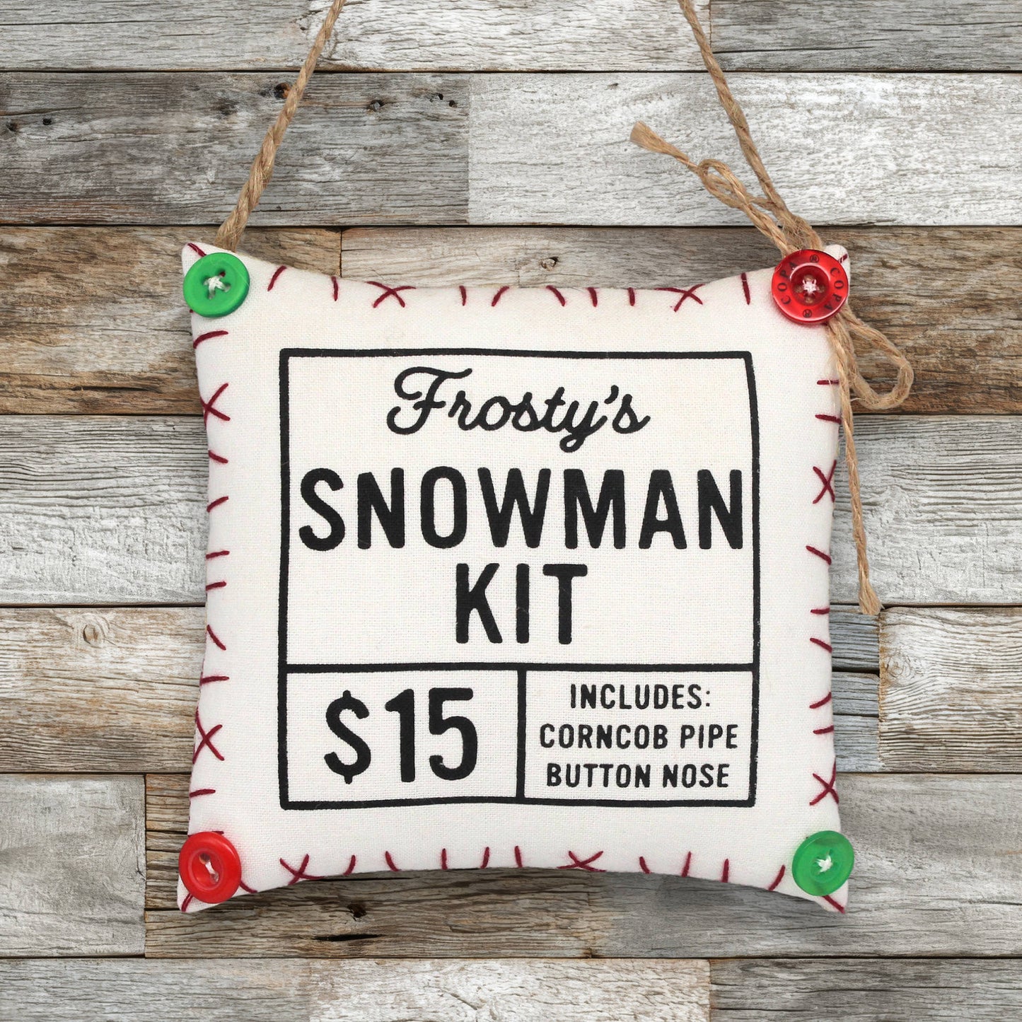 Frosty's Snowman Kit ornament with buttons on a wooden background