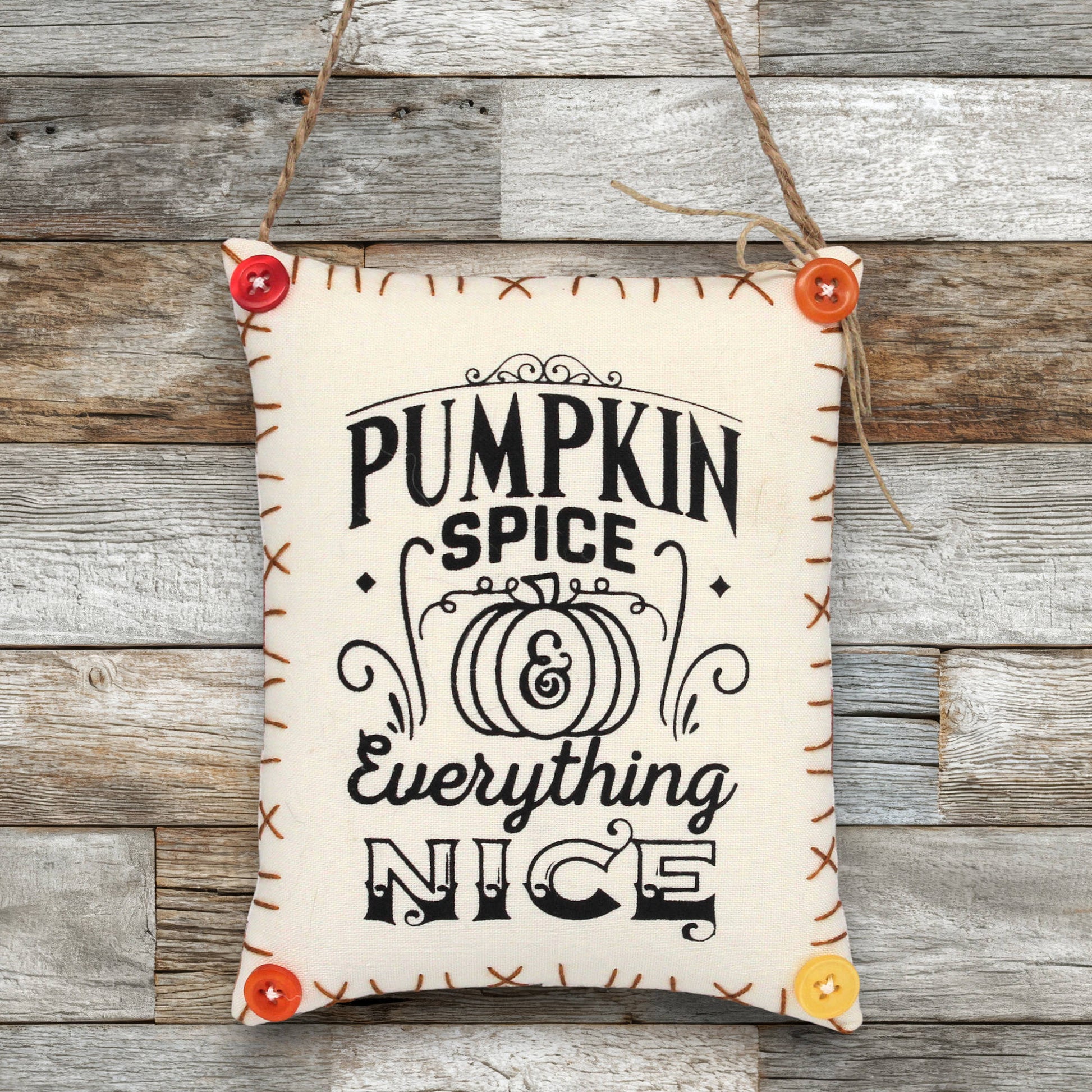 Fabric sign ornament that reads 'pumpkin spice and everything nice'
